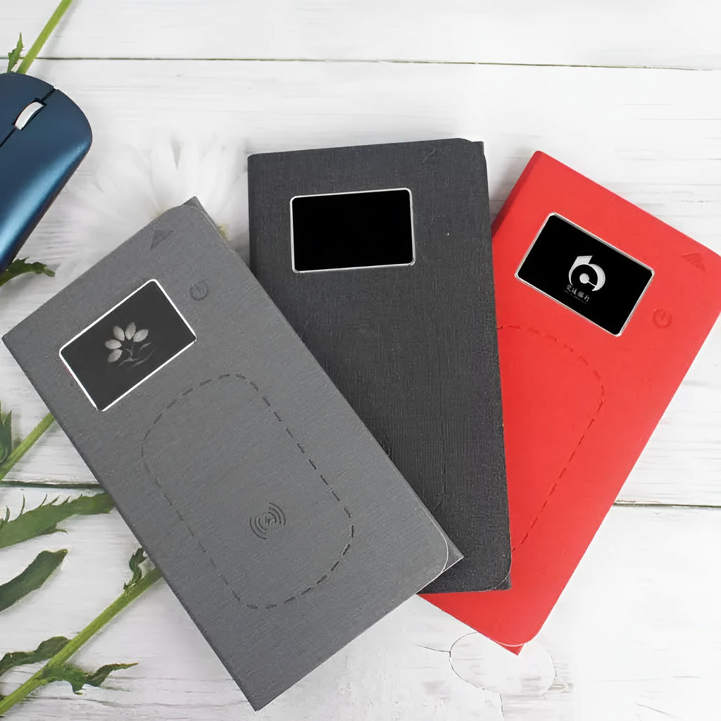 Folding wireless charging mouse pad set with cloth surface, compact mouse, and handbag.