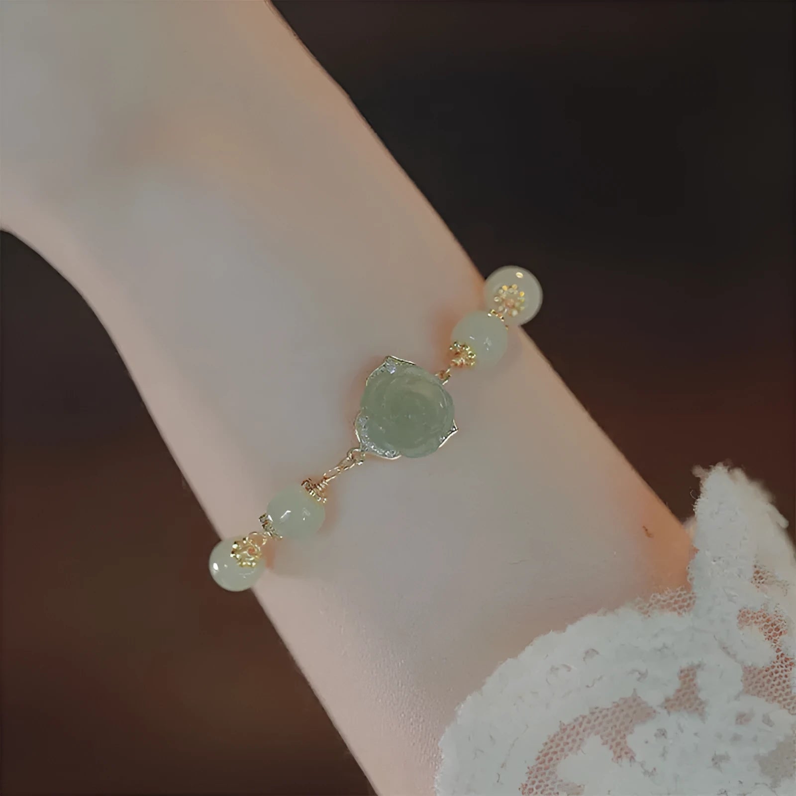Handcrafted women's bracelet with Hetian Jade rose flower design and 14K gold gilded accents