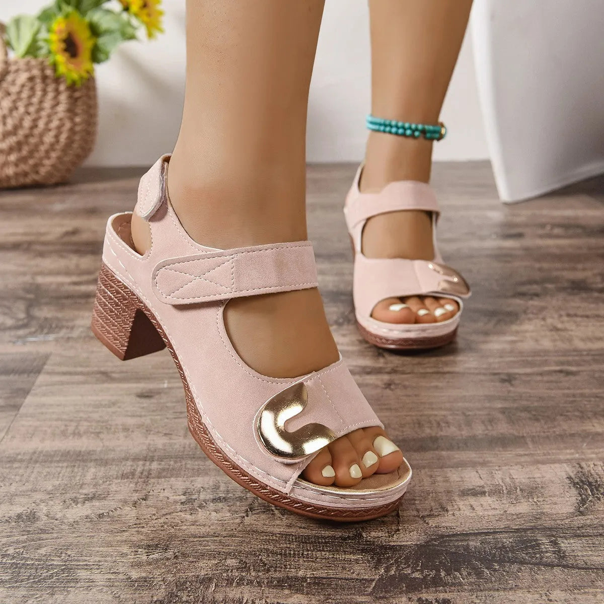 Women's light brown Velcro-strap Roman sandals with a round toe and rubber sole.