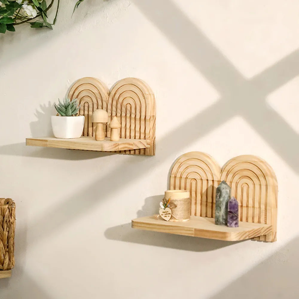 Solid wood multi-tiered wall rack holding several potted plants.