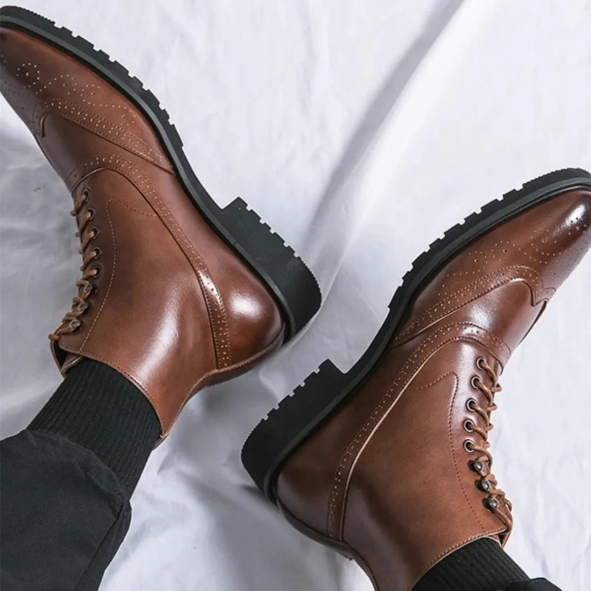 Men's mid top leather work shoes in black with thick sole and sturdy stitching