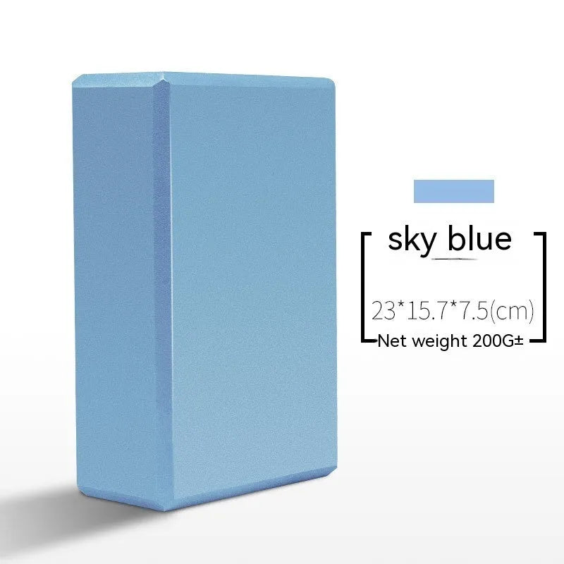 High-density EVA foam yoga block in various colours and prints on a workout mat.