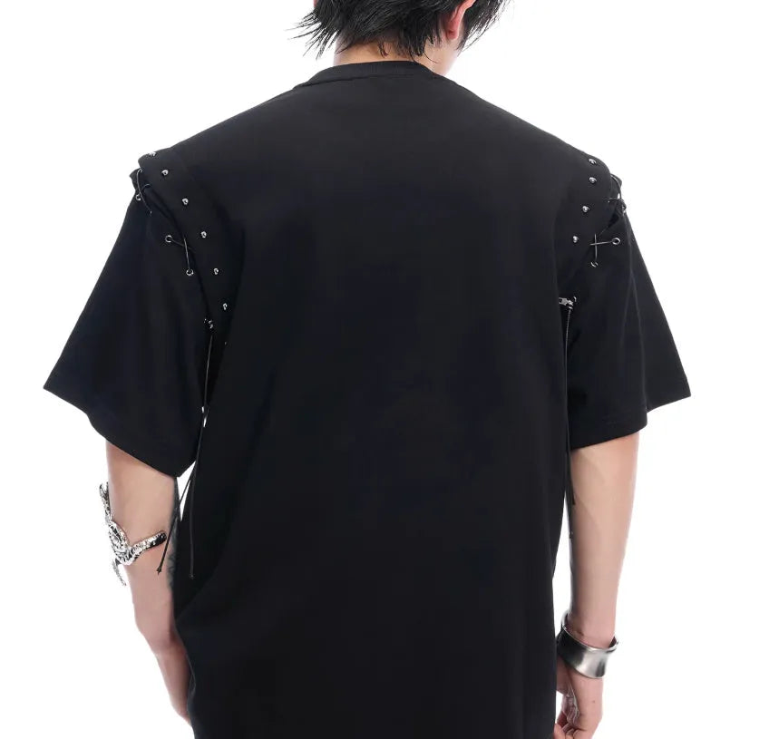Short sleeve black top with a white lace-up cutout detail on the front, deconstruction style.
