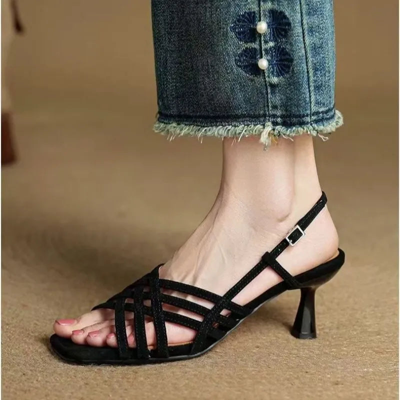Retro women's high heel sandals with thin cross straps, square toe, and ankle buckle in light brown.