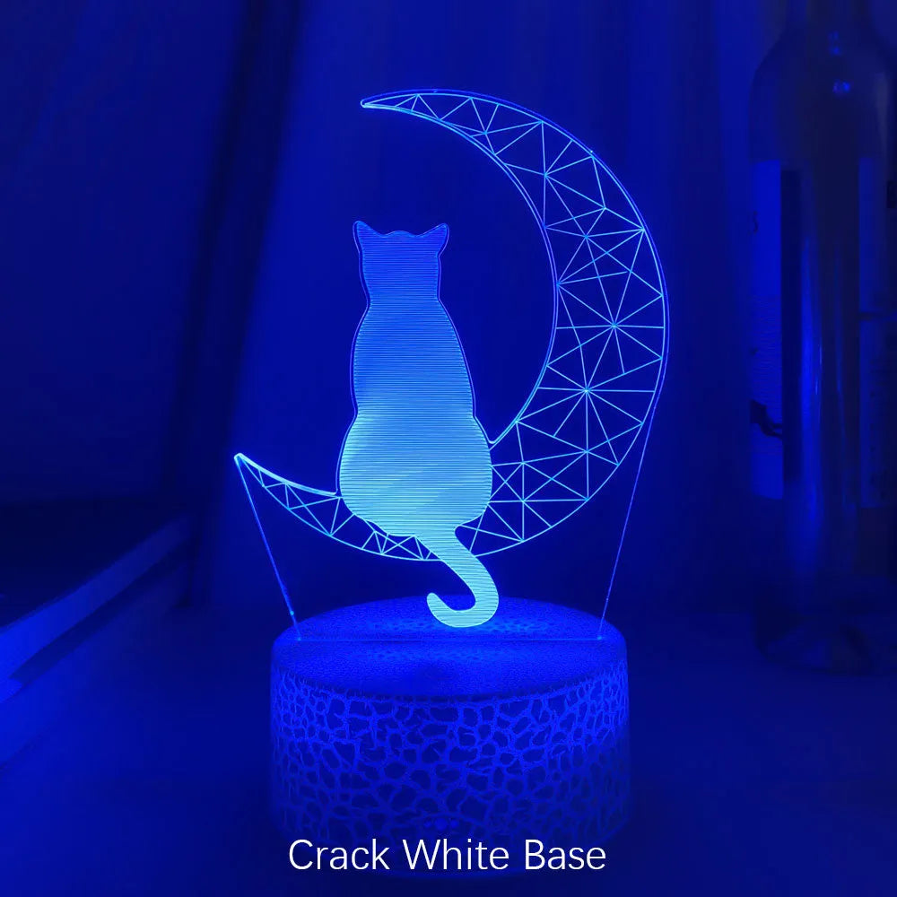 3D LED light moon and cat shape acrylic panel with remote control and USB cable on a dark surface