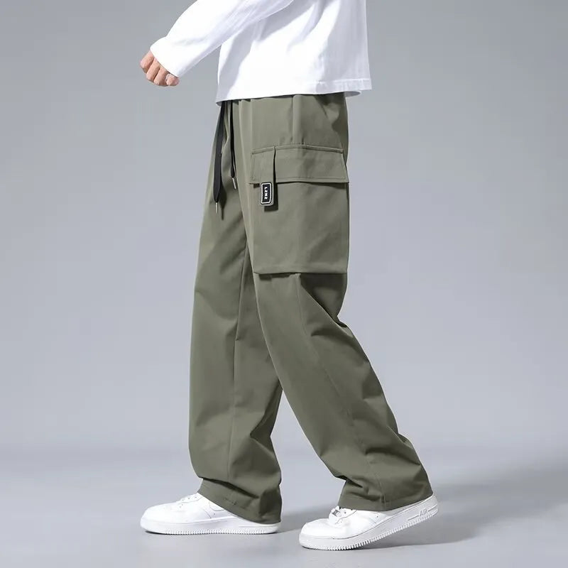 Boys' straight-leg cargo pants in army green with drawstring waist and multiple large pockets.