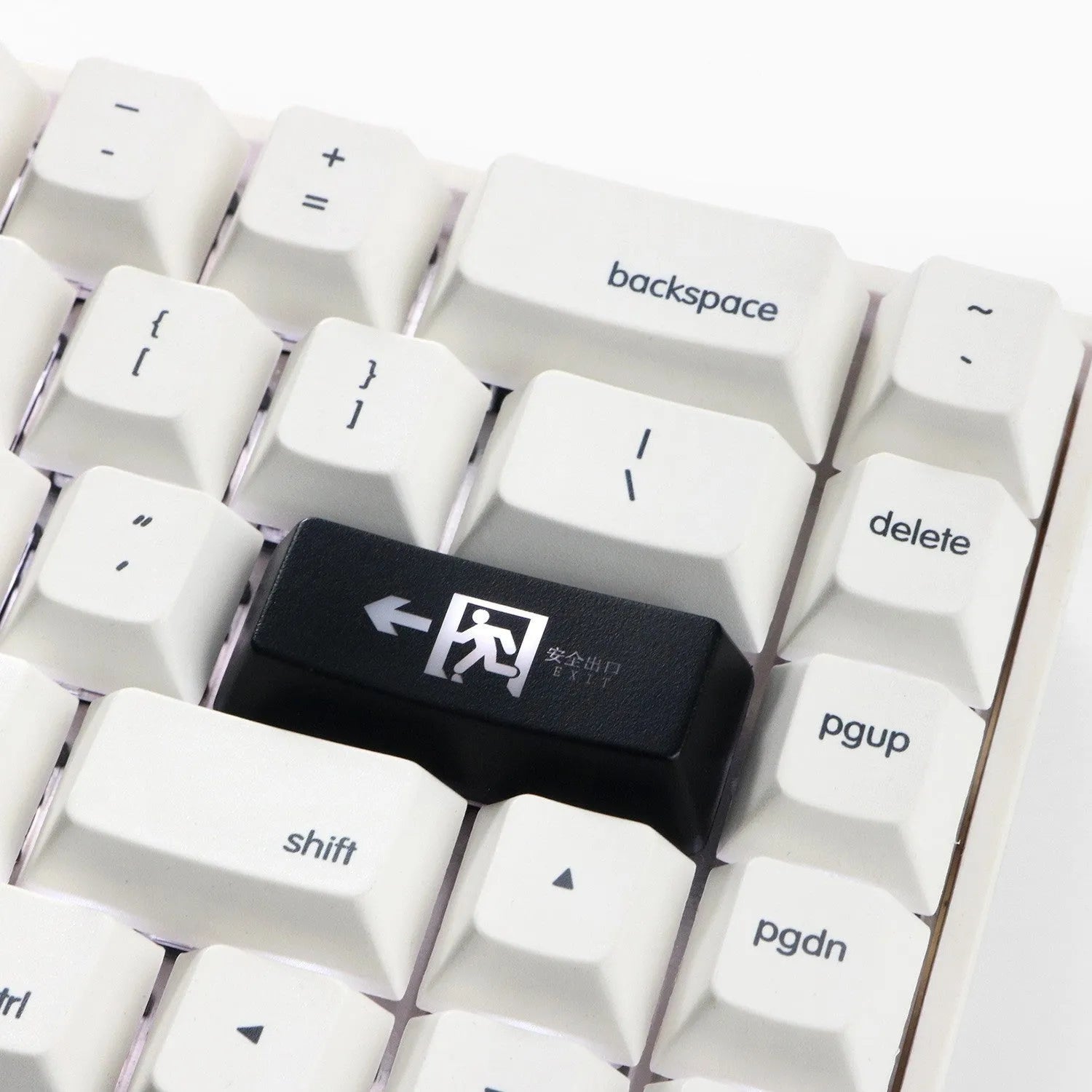 Red Safety Evacuation Exit icon key cap for a mechanical keyboard backspace key.