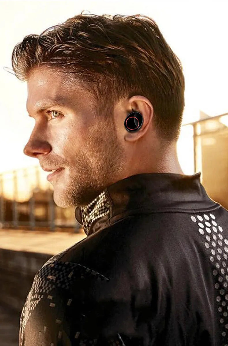 X11 black wireless Bluetooth earphones and charging case with silicone ear tips.