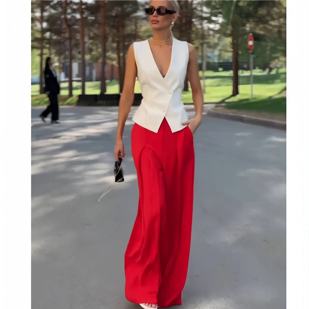 Women's beige polyester two-piece set showing sleeveless V-neck top with high-waist wide-leg trousers