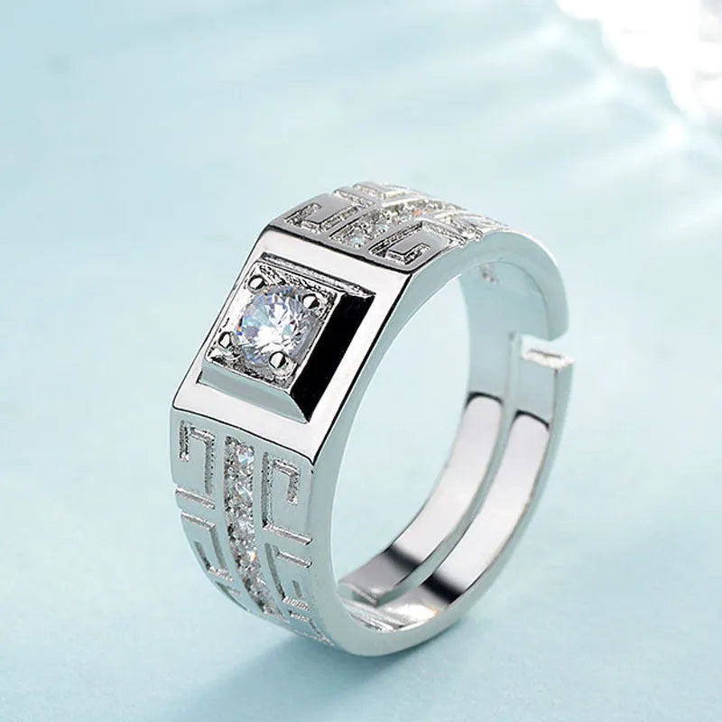 Geometric white gold moissanite ring for men with clean lines and brilliant stone