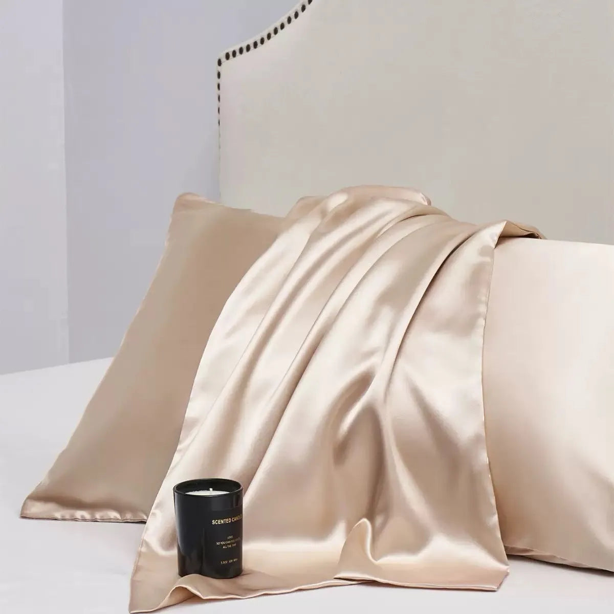 Pair of solid colour satin cloth pillowcases showing colour options including navy blue, wine red and light pink