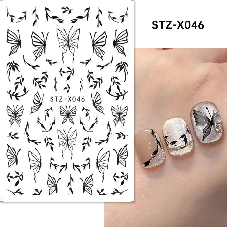 Sheet of black and silver strip nail art stickers with cartoon and love heart designs