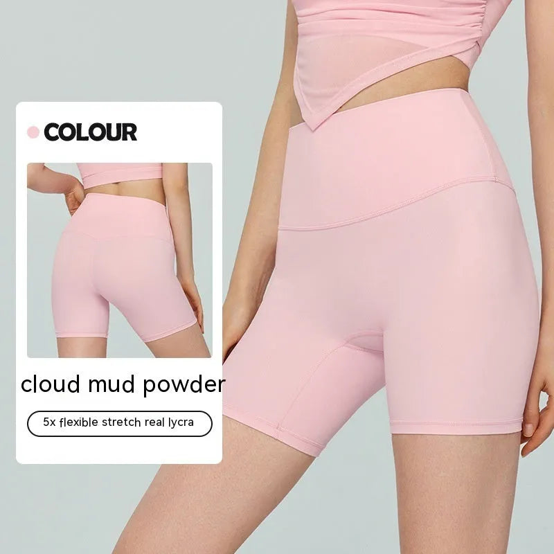 Women's lycra yoga tight shorts in leaf green colour showing high waist and short length design
