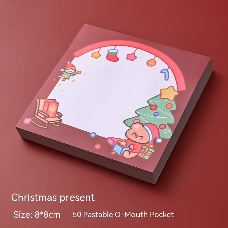Christmas sticky notes pad with festive designs including elf, gift, sled, Santa Claus, bear, and snowman