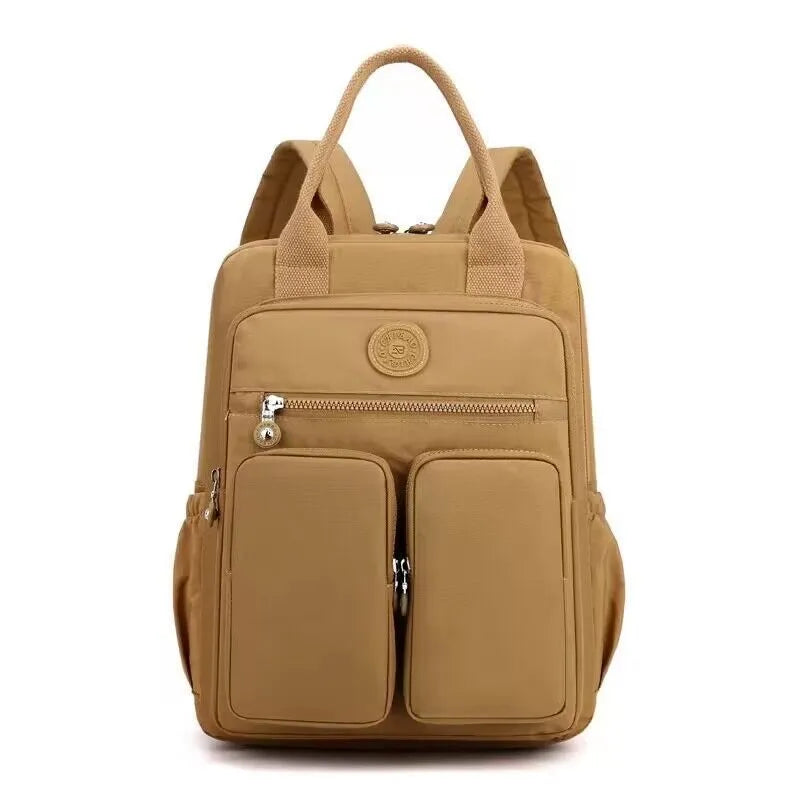 Women's waterproof nylon travel backpack with multiple internal compartments in various colours