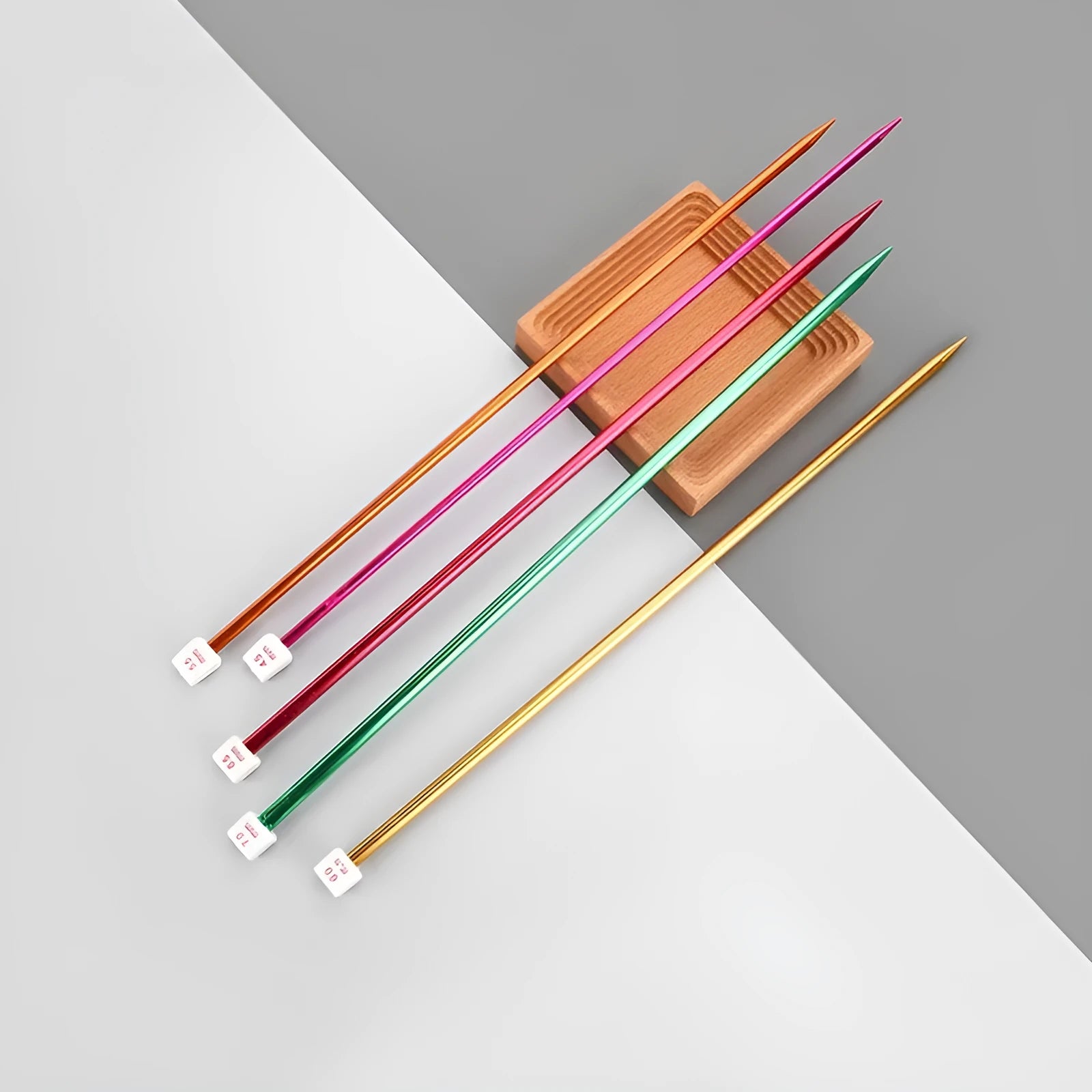 Set of lengthened crochet hooks with caps in 13 sizes from 2.0mm to 10.0mm, two hooks per size.