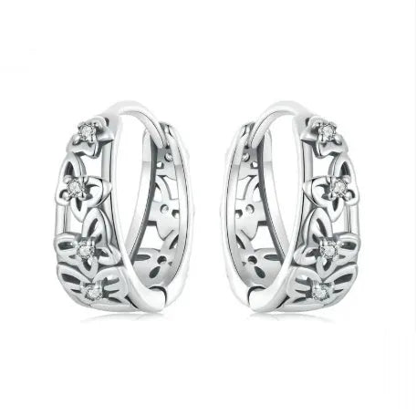 Retro hollow butterfly earrings in oxidised sterling silver with zircon stone accents on a white background.