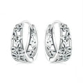 Retro hollow butterfly earrings in oxidised sterling silver with zircon stone accents on a white background.