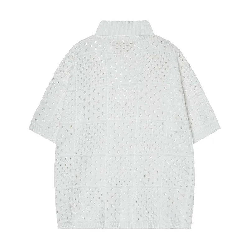 Teenager wearing a solid black loose-fit short-sleeved polo shirt with a hollow knitted texture.