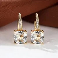 Square geometric ear hook studs with a round zircon stone, shown in a gold electroplated finish.