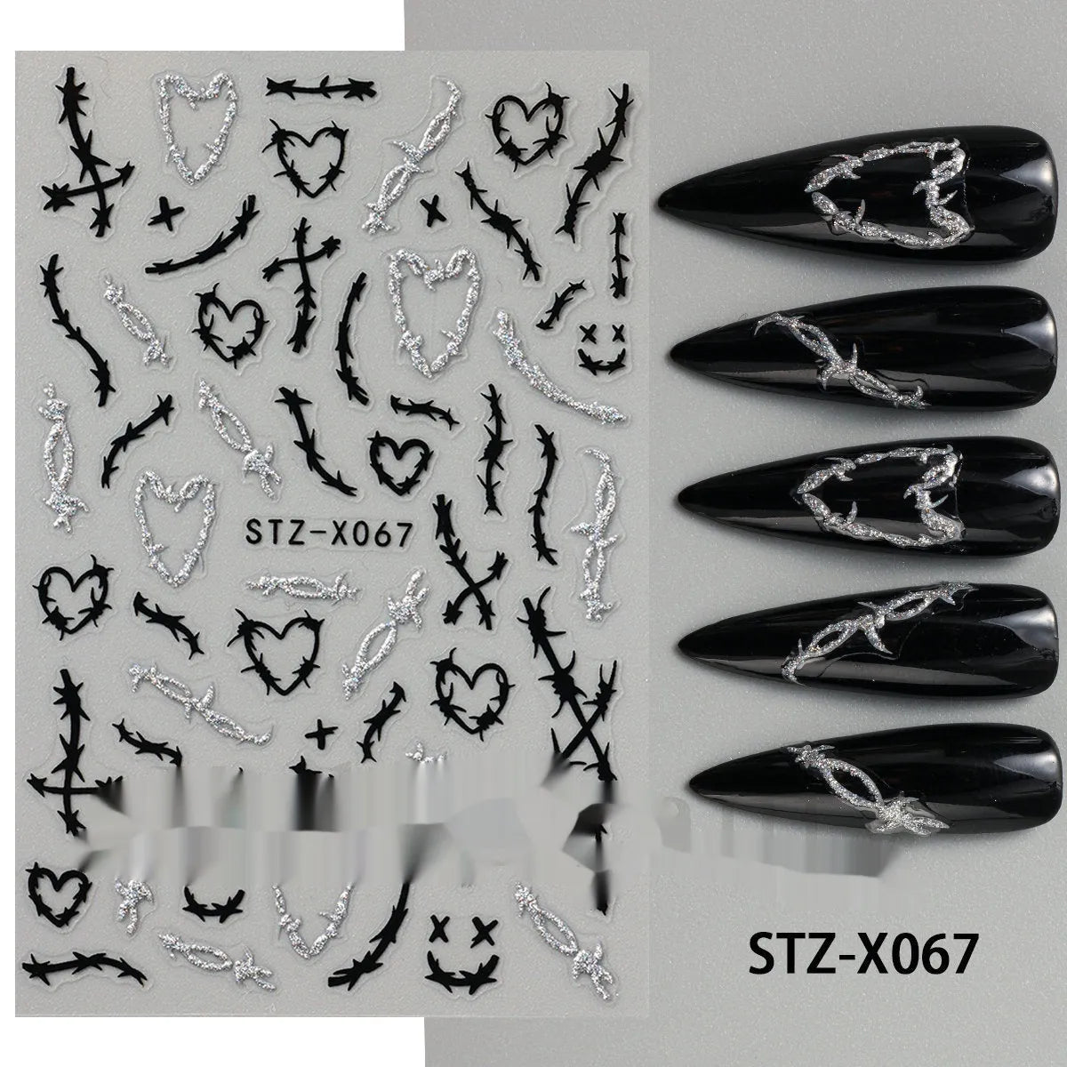 Sheet of black and silver strip nail art stickers with cartoon and love heart designs