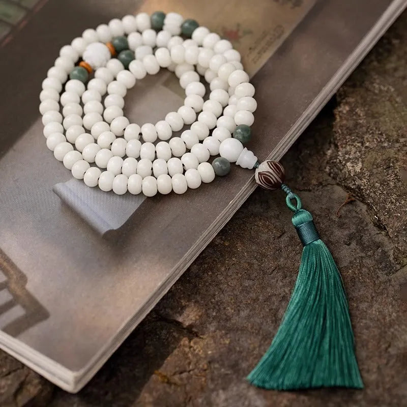 White jade Bodhi beads long bracelet with 6x8mm beads, showing various style options.