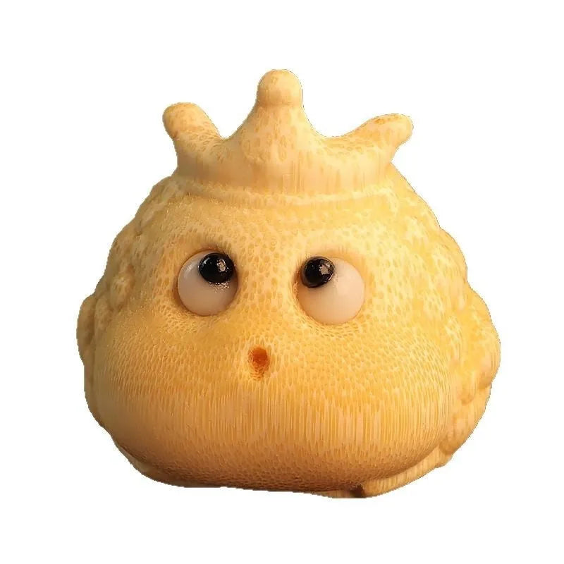Solid bamboo carving of a cute Crown Princess Toad ornament, showing live eye detail.