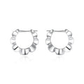 Silver geometric hoop earrings with round elements and retro styling