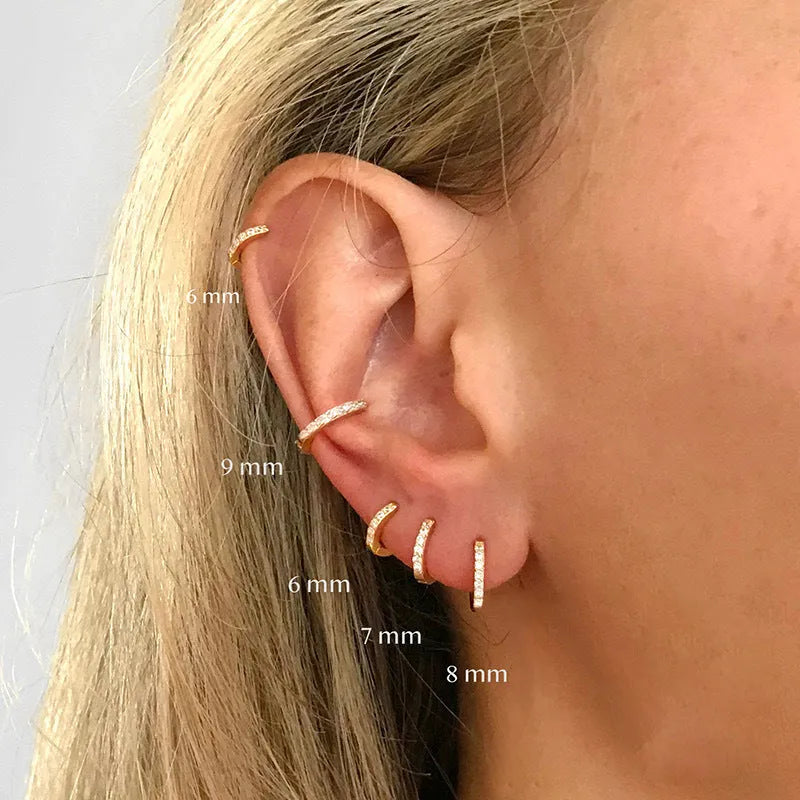Geometric circle zircon perforated stud earrings in gold, rose gold, and silver colours showing perforated pattern detail