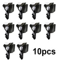 Black plastic putter fixing clip attached to golf bag, holding a putter securely