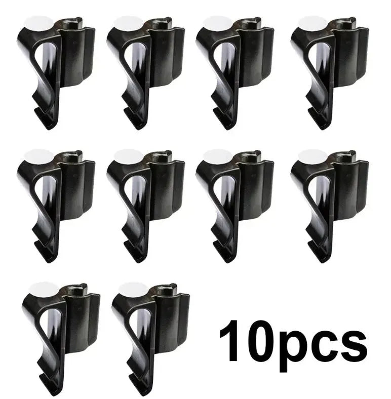 Black plastic putter fixing clip attached to golf bag, holding a putter securely