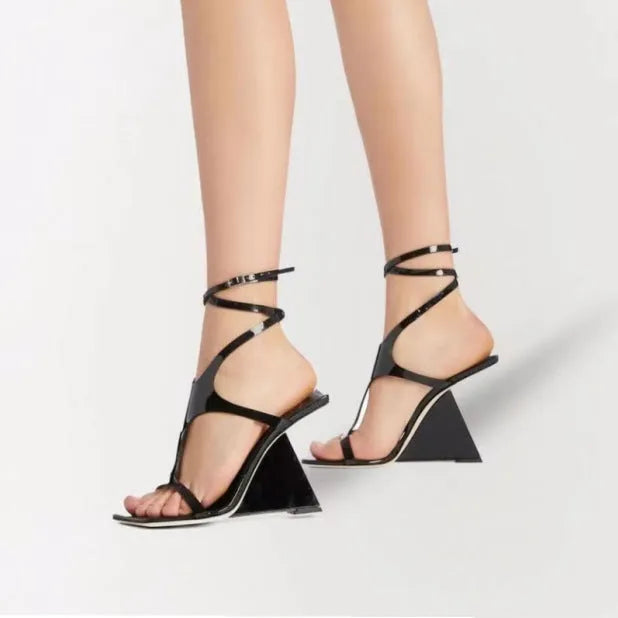 Women's black summer sandal with 9.5cm heel, square toe, and button fastening on a white background.
