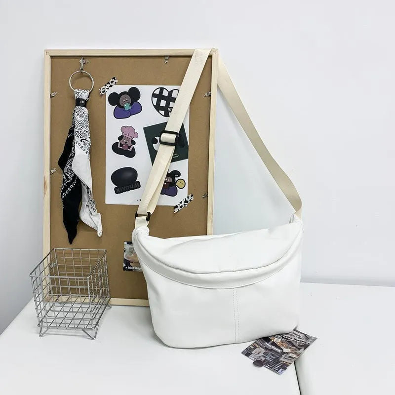 Retro large capacity men's crossbody bag in brown PU leather with zipper closure on white background.