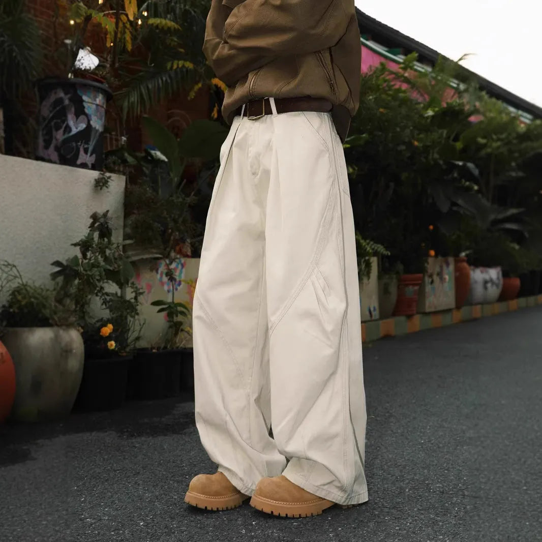 Men's pleated straight loose trousers in black striped pattern showing straight leg design