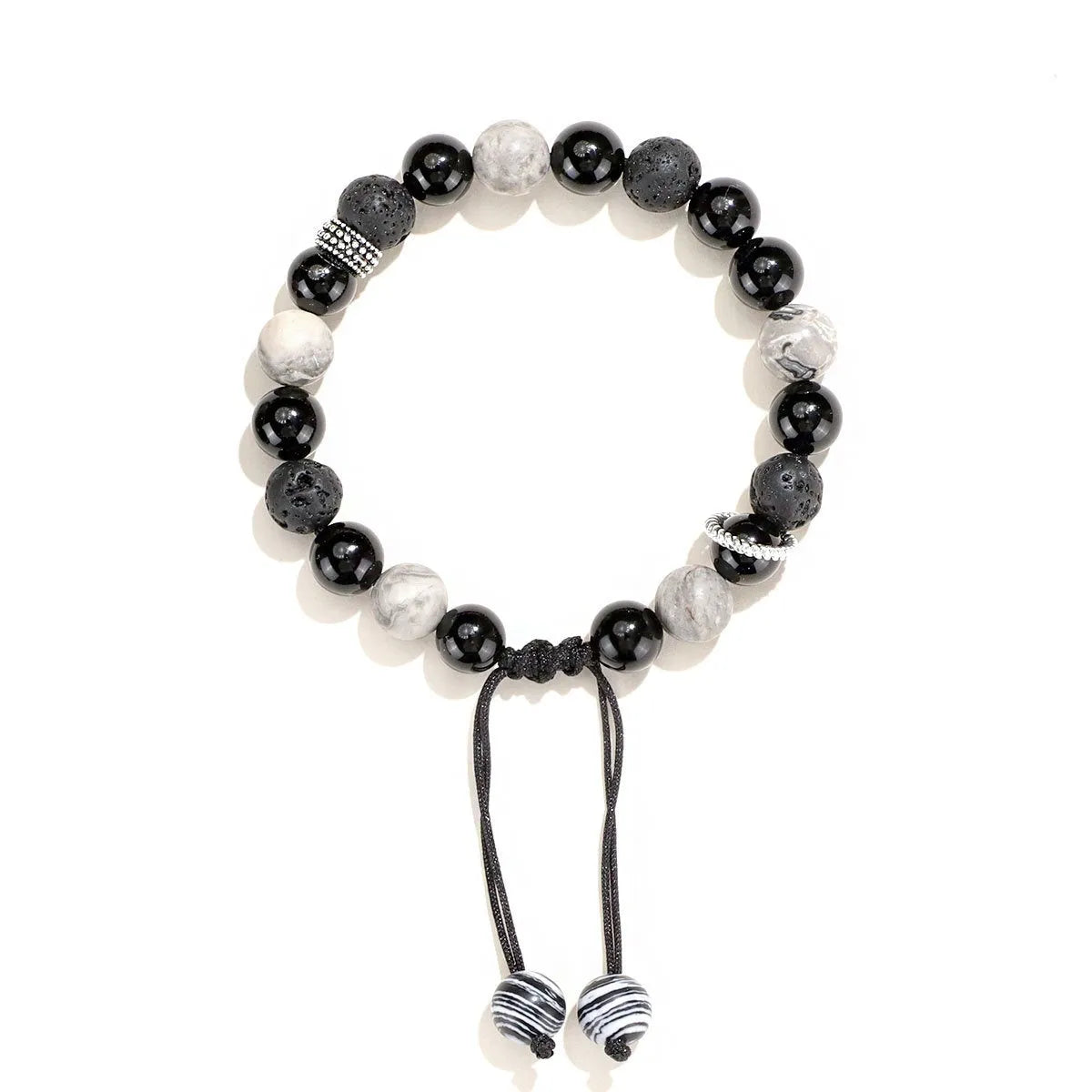 Black agate map stone volcanic rock bracelet in diamond shape, New Chinese style, on wrist.