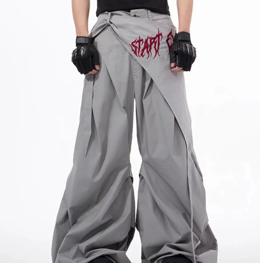 Boy modelling black wide-leg Korean-style summer pants on a casual backdrop.