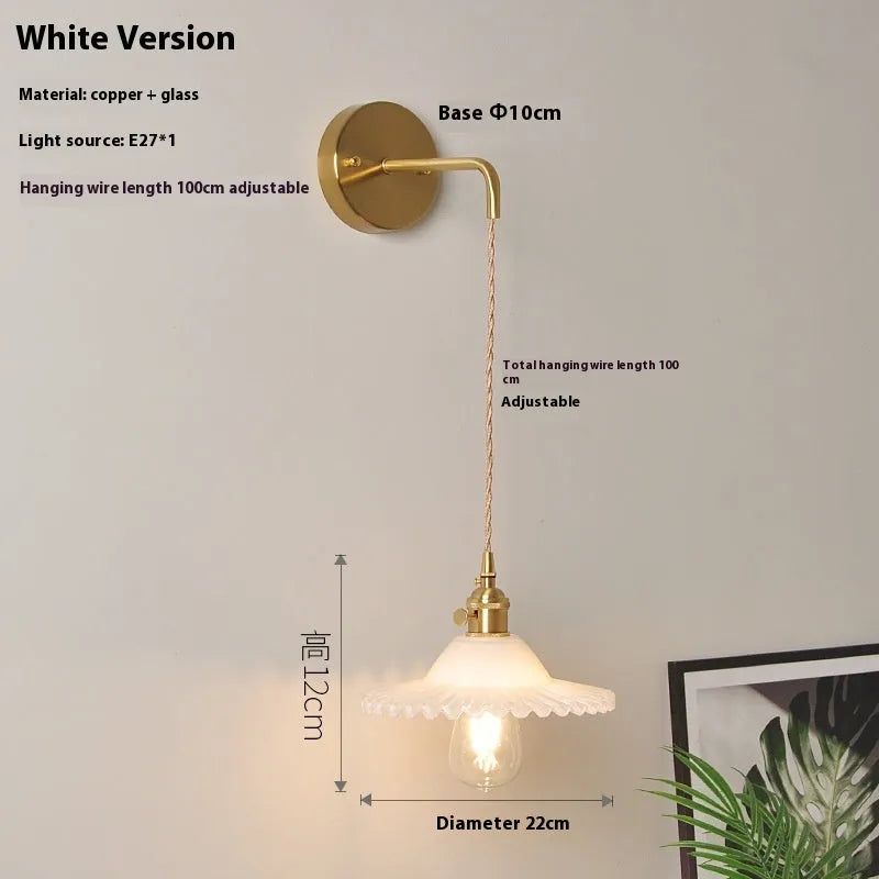 Retro copper lotus wall lamp with glass shade in choice of six colours, suspended from a wall
