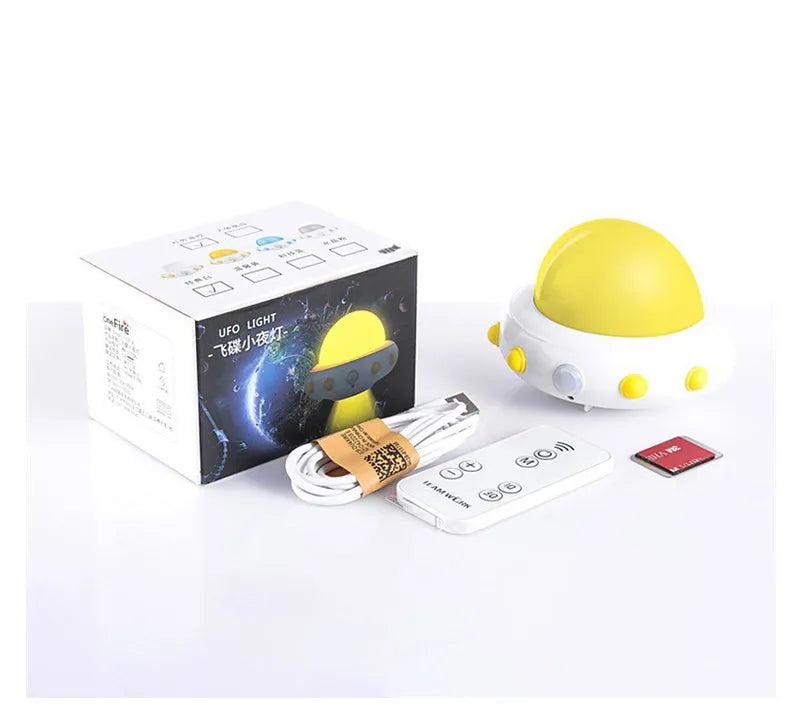 Remote control UFO shaped bedside night light in blue, pink, or white with cartoon design