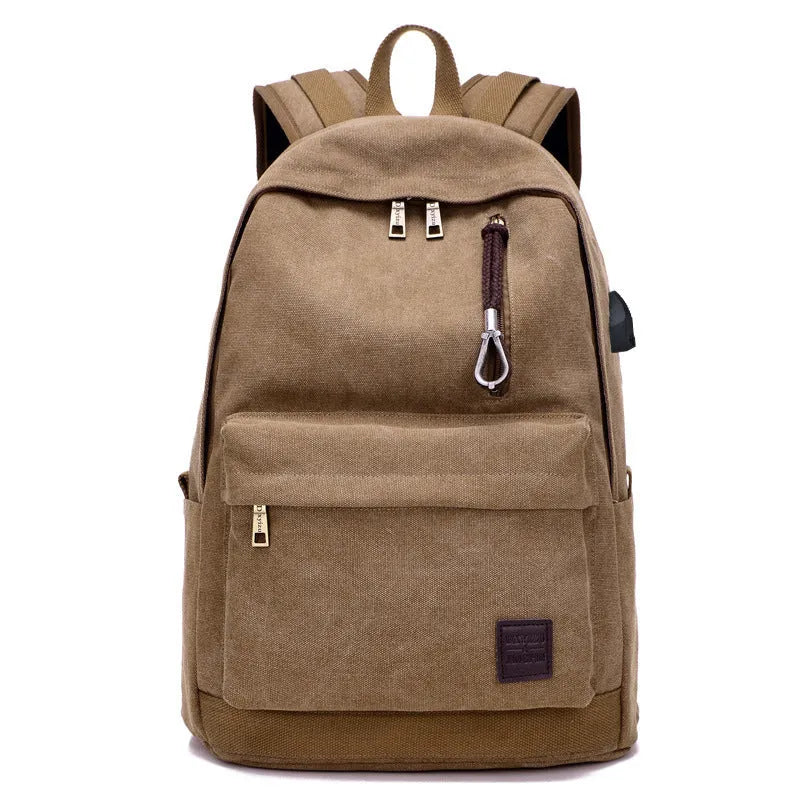 Canvas backpack with USB charging port showing multiple compartments including laptop pocket