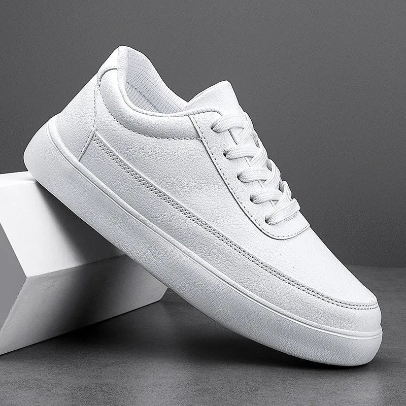 Women's white leather lace-up casual flat shoes on a solid background.
