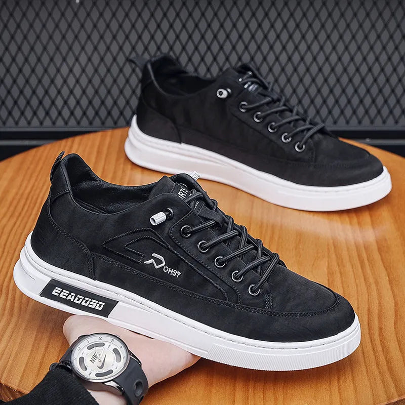 Grey men's canvas casual shoes with leather lining and rubber sole showing stitching details