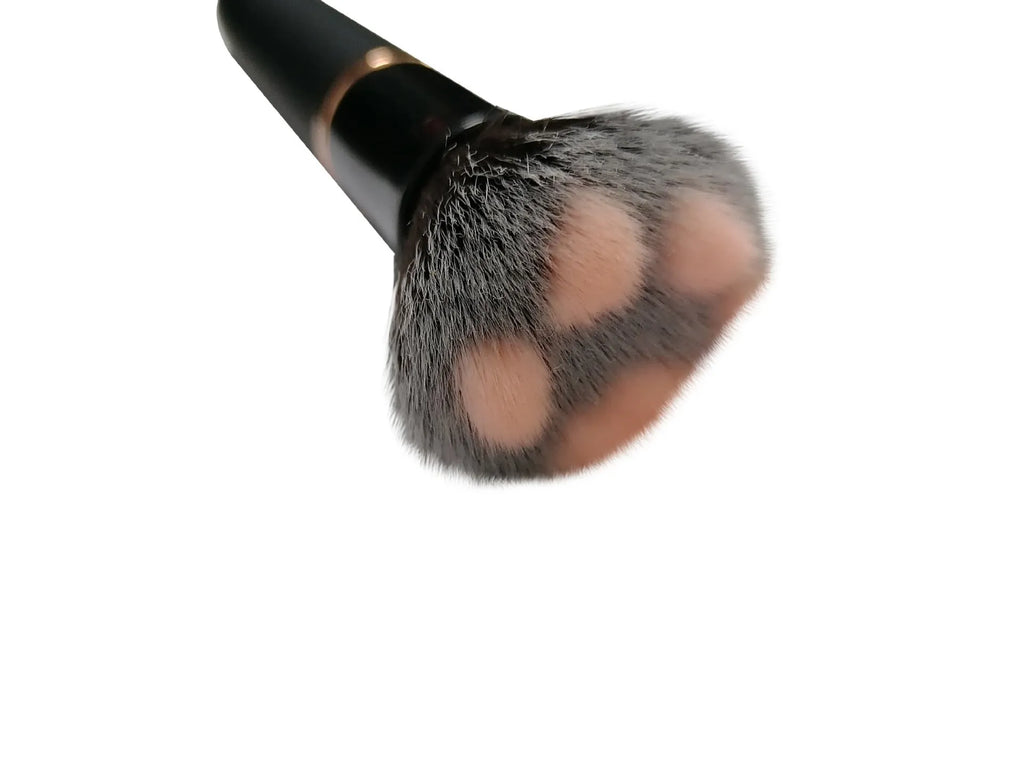 Women's beauty vibrator cosmetics brush massage toy in black with USB recharge port and one-button control