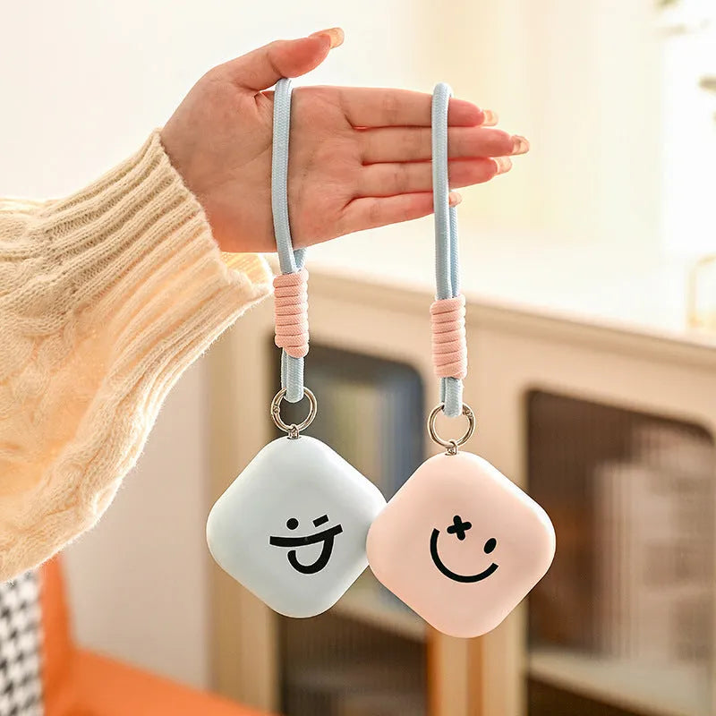 Square rechargeable hand warmer in white, light green, and pink colours with USB charging