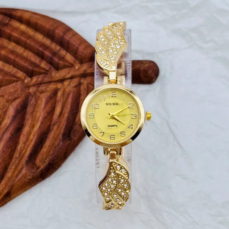 Stainless steel women's watch with round dial on a wrist, showing the Vachette clasp buckle.