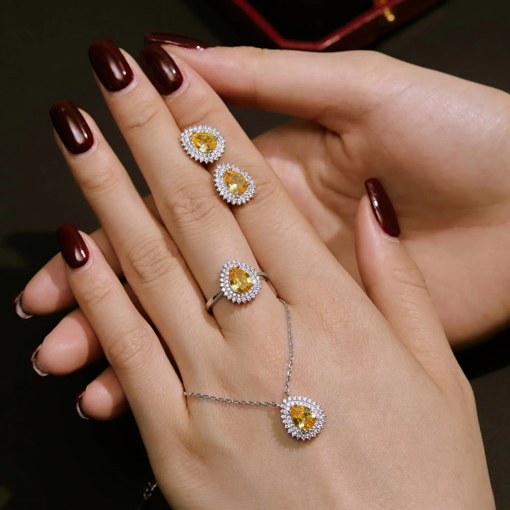 Sterling silver jewellery set with water droplet design necklace ring and earrings in gold finish