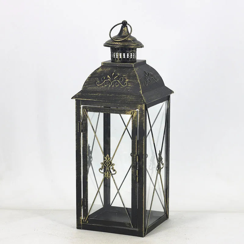 Black and white gold wrought iron storm lantern with tempered glass in three sizes for courtyard decoration.