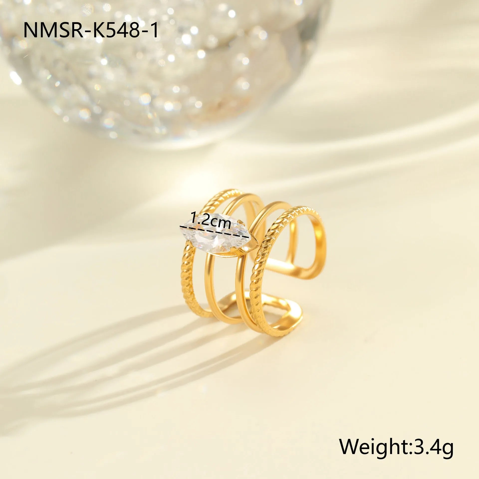 Gold-coloured adjustable stainless steel ring with zircon geometric shapes on white background.