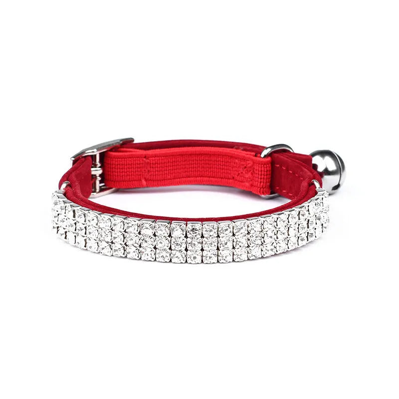 Rhinestone-studded velvet cat collar in assorted colours on a white background