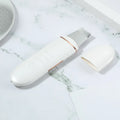 Ultrasonic skin rejuvenation whitening shoveling machine in dark green with shovel knife on white background