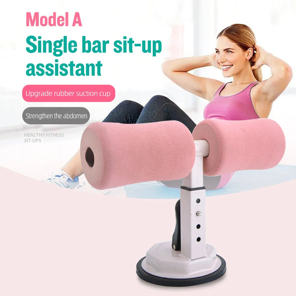 Pink adjustable sit-up bar floor assistant with foam pad and suction base on smooth floor